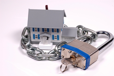 Miniature House With Lock and Chain